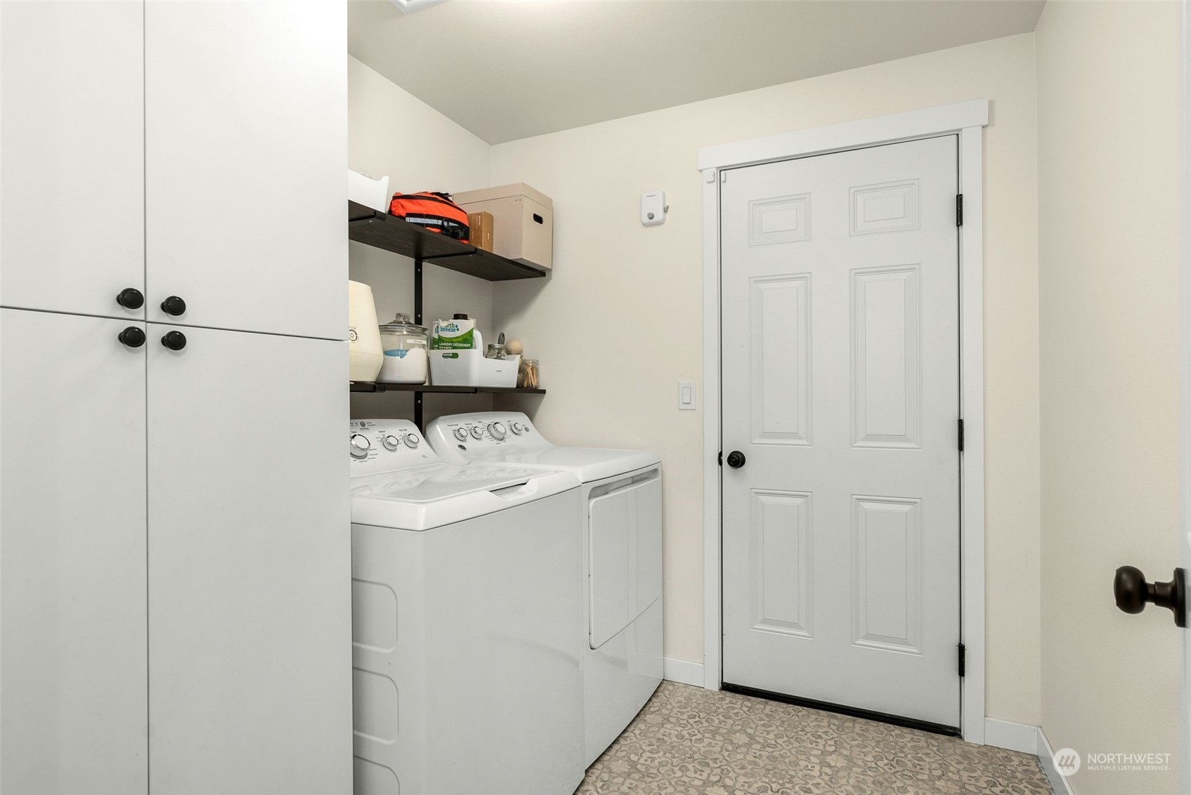 9924 Angeline Road East Bonney Lake, WA 98391 - Photo 20 of 31 a view of storage and utility room with washer and dryer