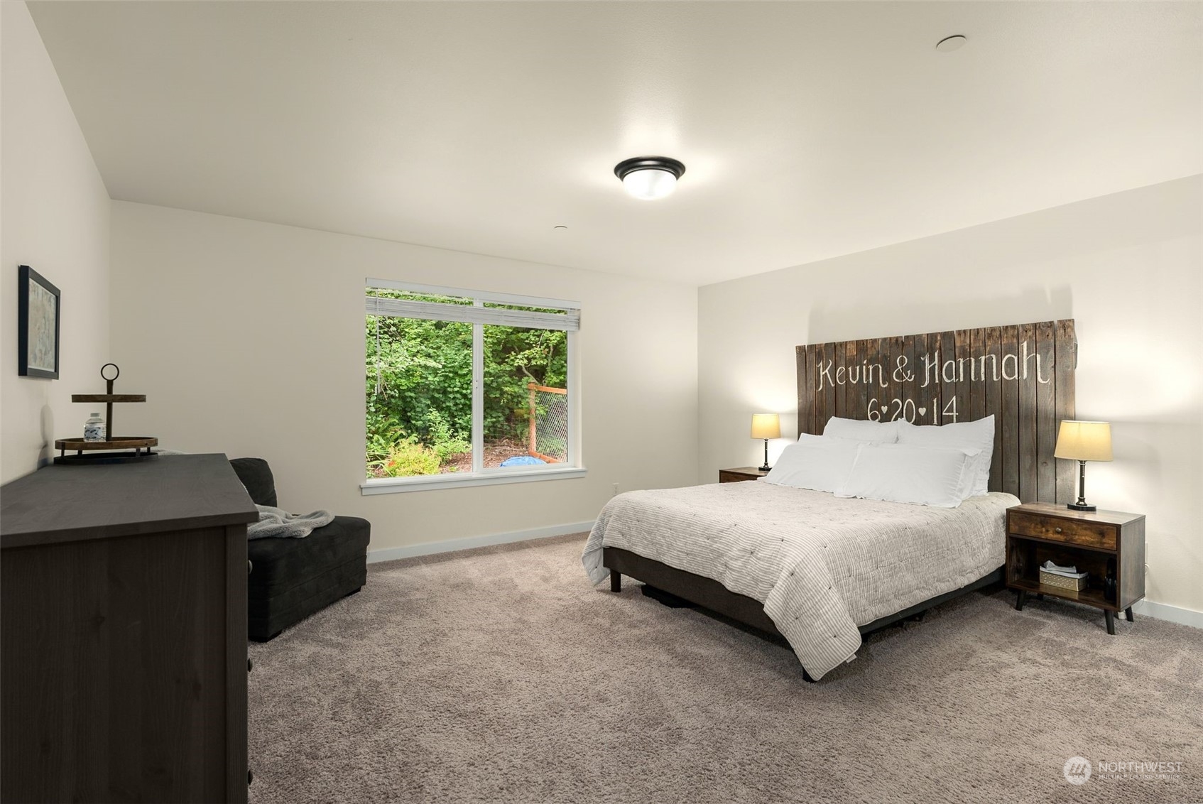 9924 Angeline Road East Bonney Lake, WA 98391 - Photo 21 of 31 a spacious bedroom with a bed and a window