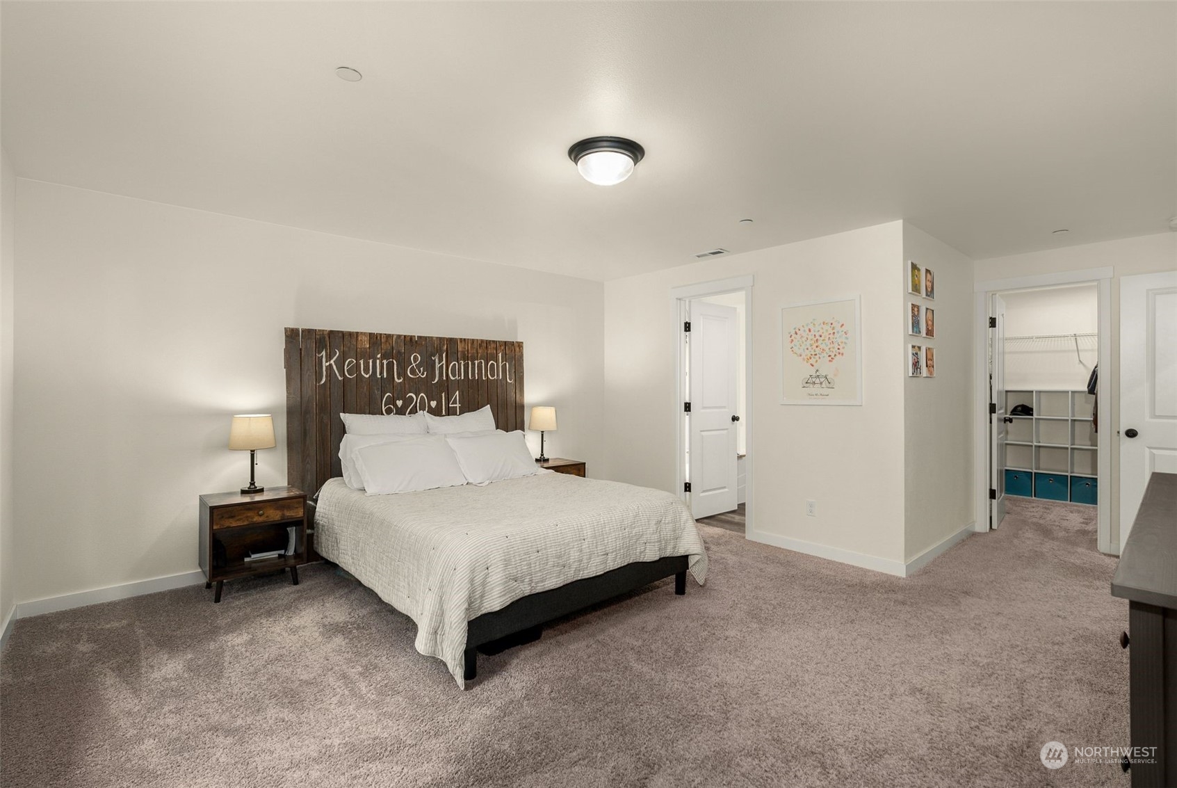 9924 Angeline Road East Bonney Lake, WA 98391 - Photo 22 of 31 a spacious bedroom with a bed and a lamp