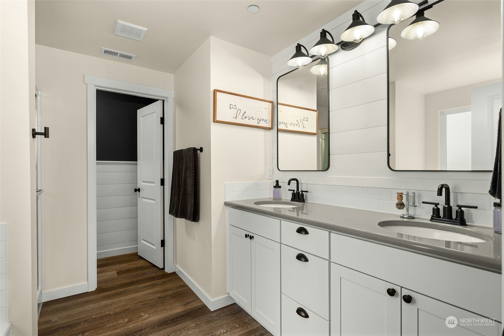 9924 Angeline Road East Bonney Lake, WA 98391 - Photo 24 of 31 a bathroom with a double vanity sink and mirror