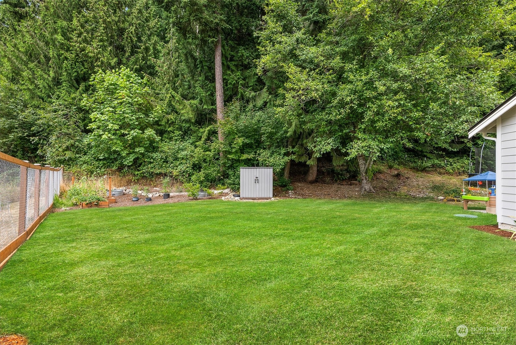 9924 Angeline Road East Bonney Lake, WA 98391 - Photo 27 of 31 a view of a backyard with a garden