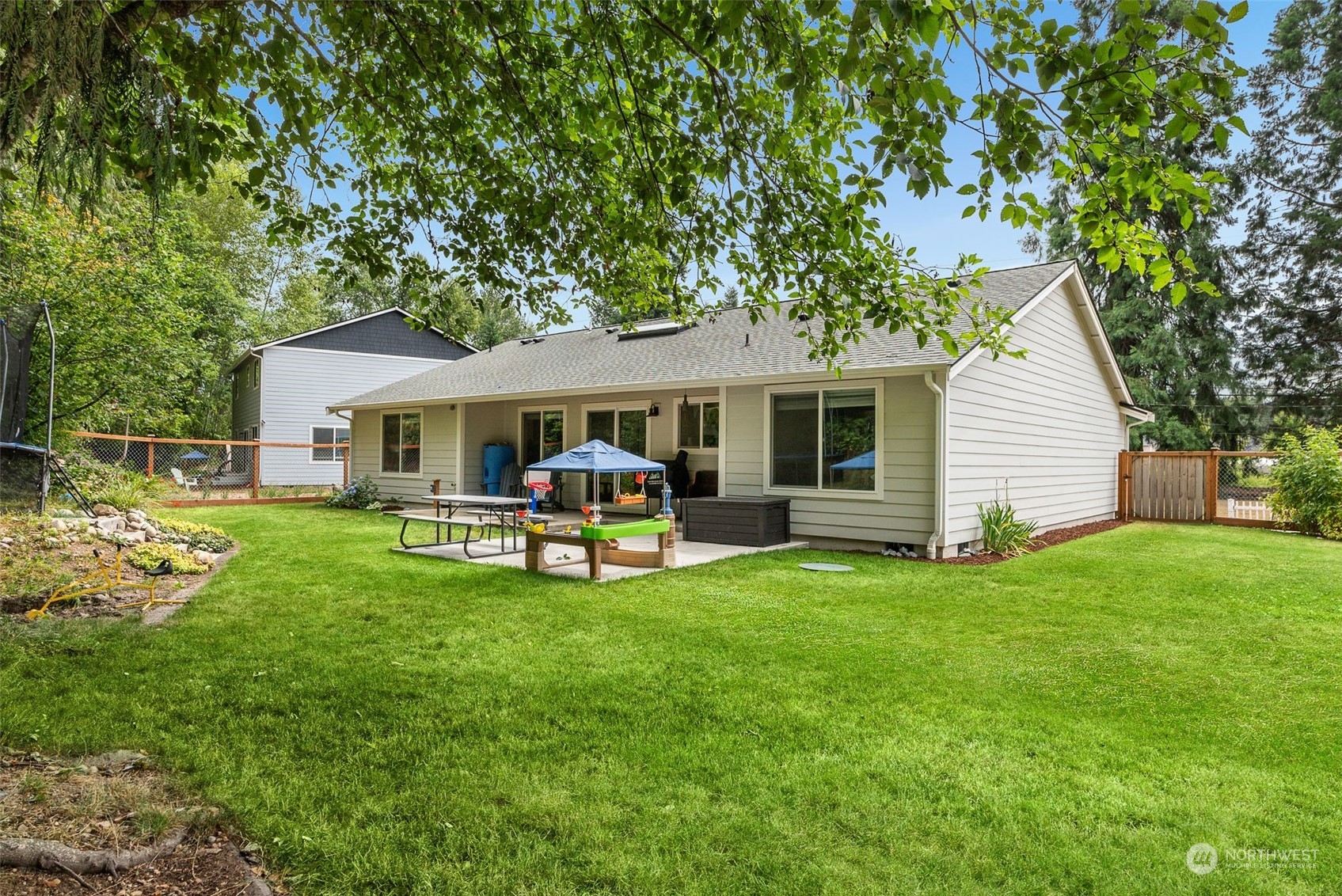 9924 Angeline Road East Bonney Lake, WA 98391 - Photo 28 of 31 a front view of a house with garden