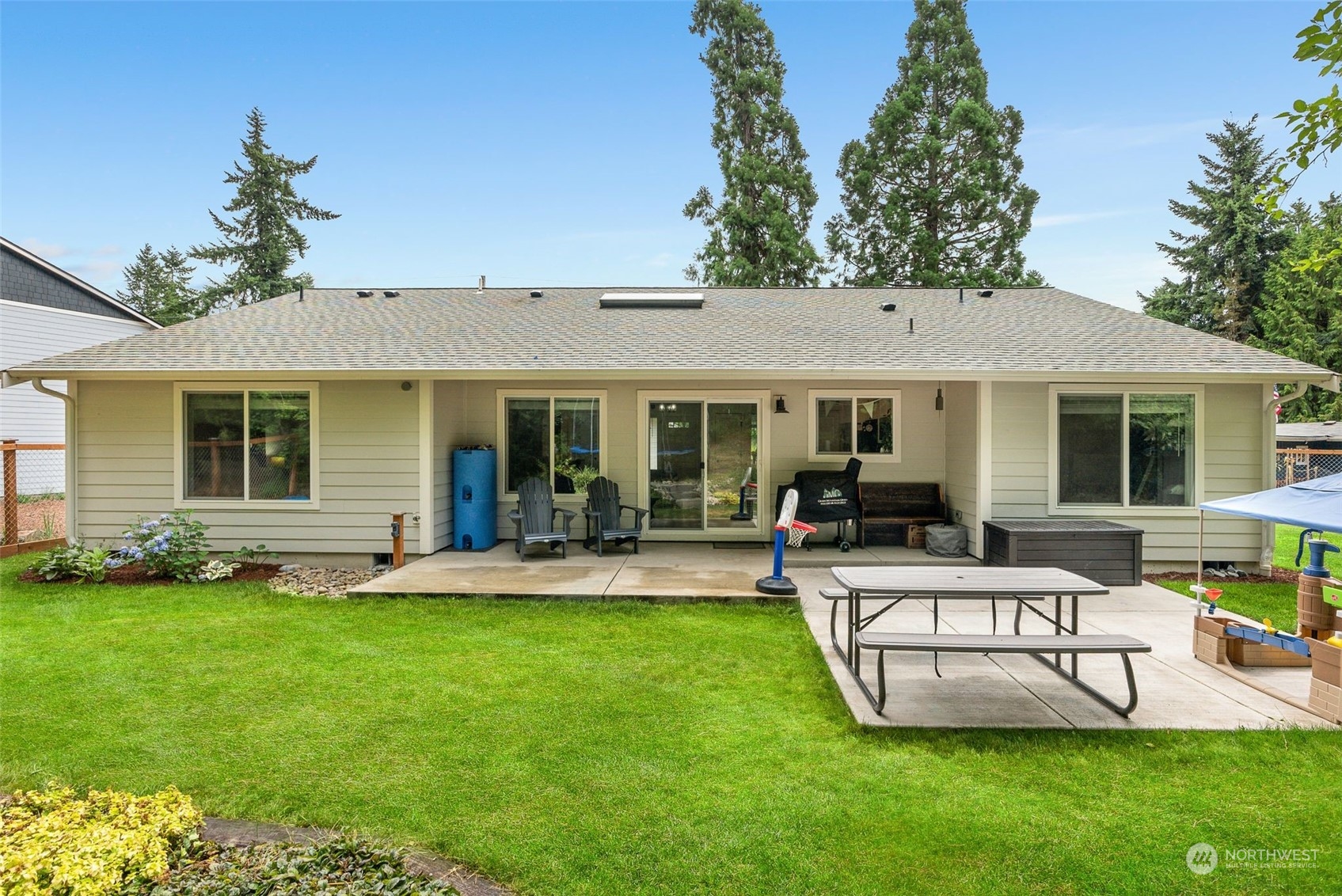 9924 Angeline Road East Bonney Lake, WA 98391 - Photo 29 of 31 a view of a house with a yard and porch