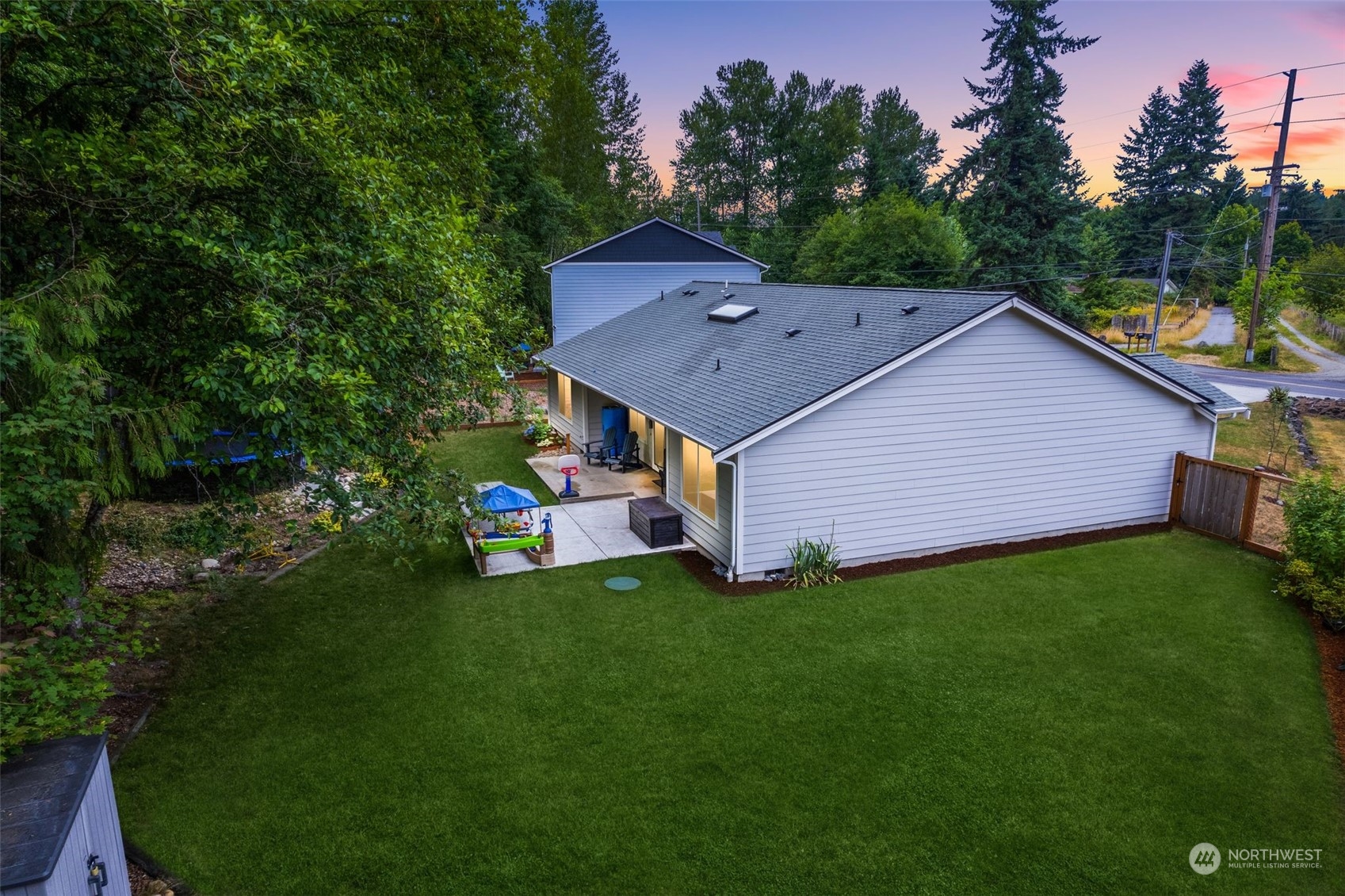 9924 Angeline Road East Bonney Lake, WA 98391 - Photo 30 of 31 a aerial view of a house next to a big yard and large trees
