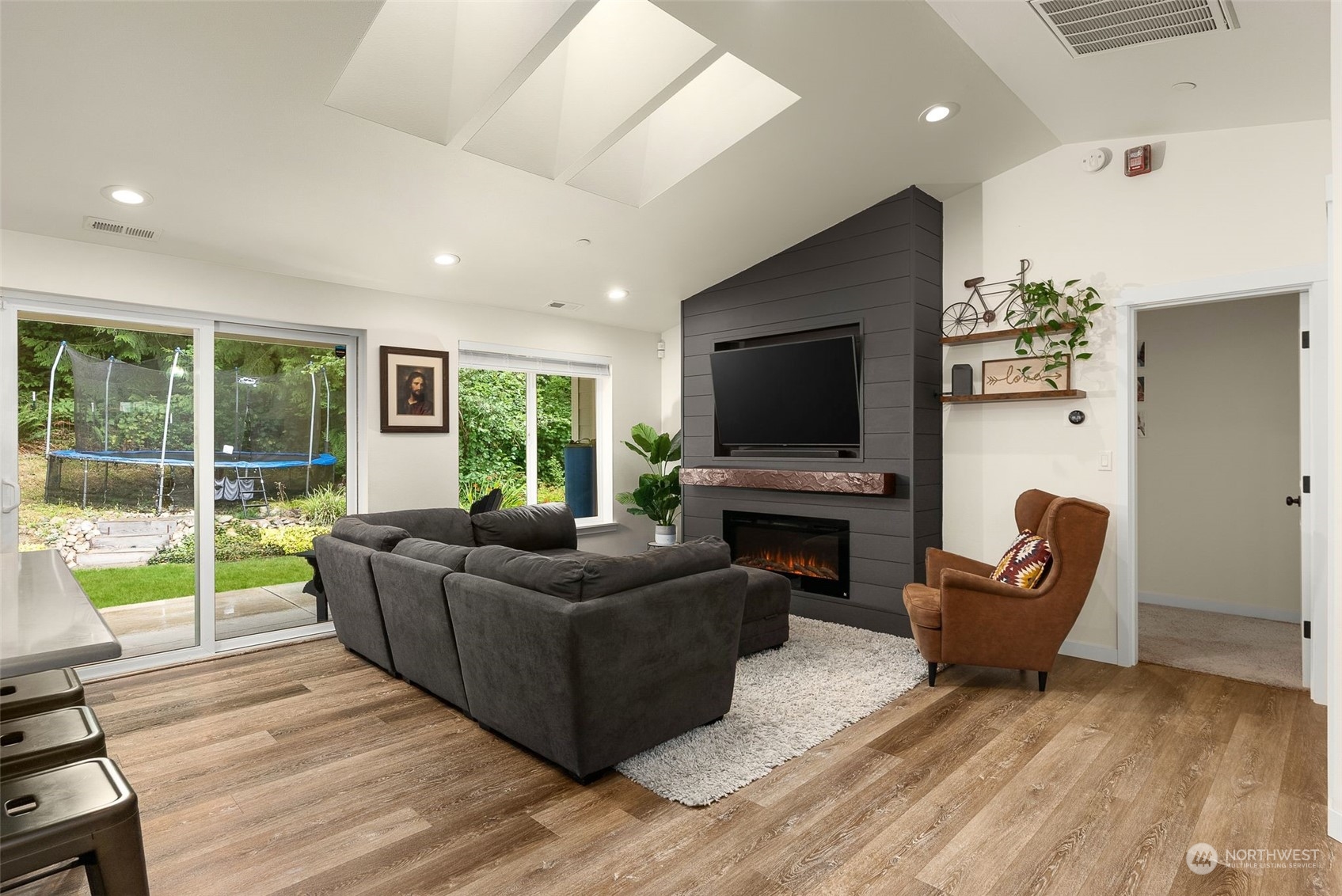 9924 Angeline Road East Bonney Lake, WA 98391 - Photo 4 of 31 a living room with furniture and a flat screen tv
