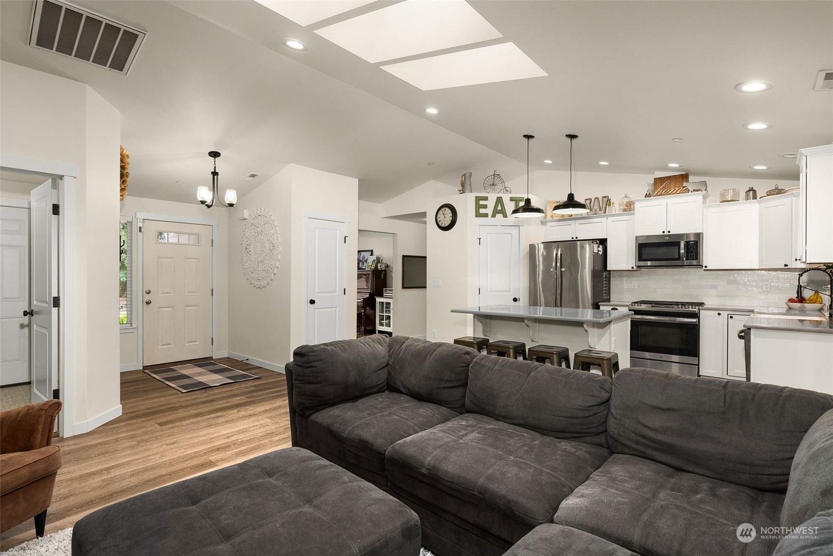 9924 Angeline Road East Bonney Lake, WA 98391 - Photo 6 of 31 a living room with furniture and kitchen view