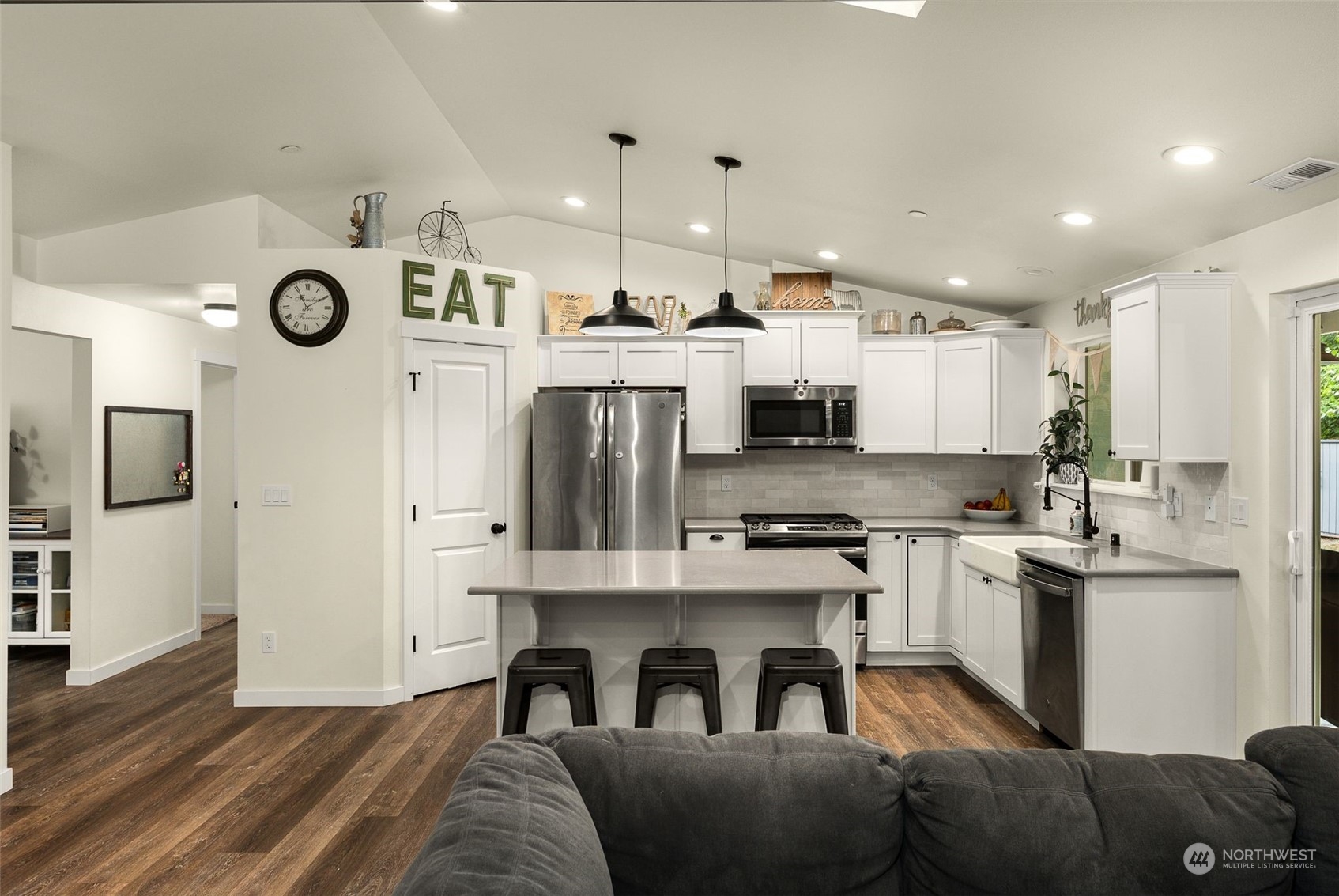 9924 Angeline Road East Bonney Lake, WA 98391 - Photo 7 of 31 a open kitchen with stainless steel appliances granite countertop a stove and a refrigerator