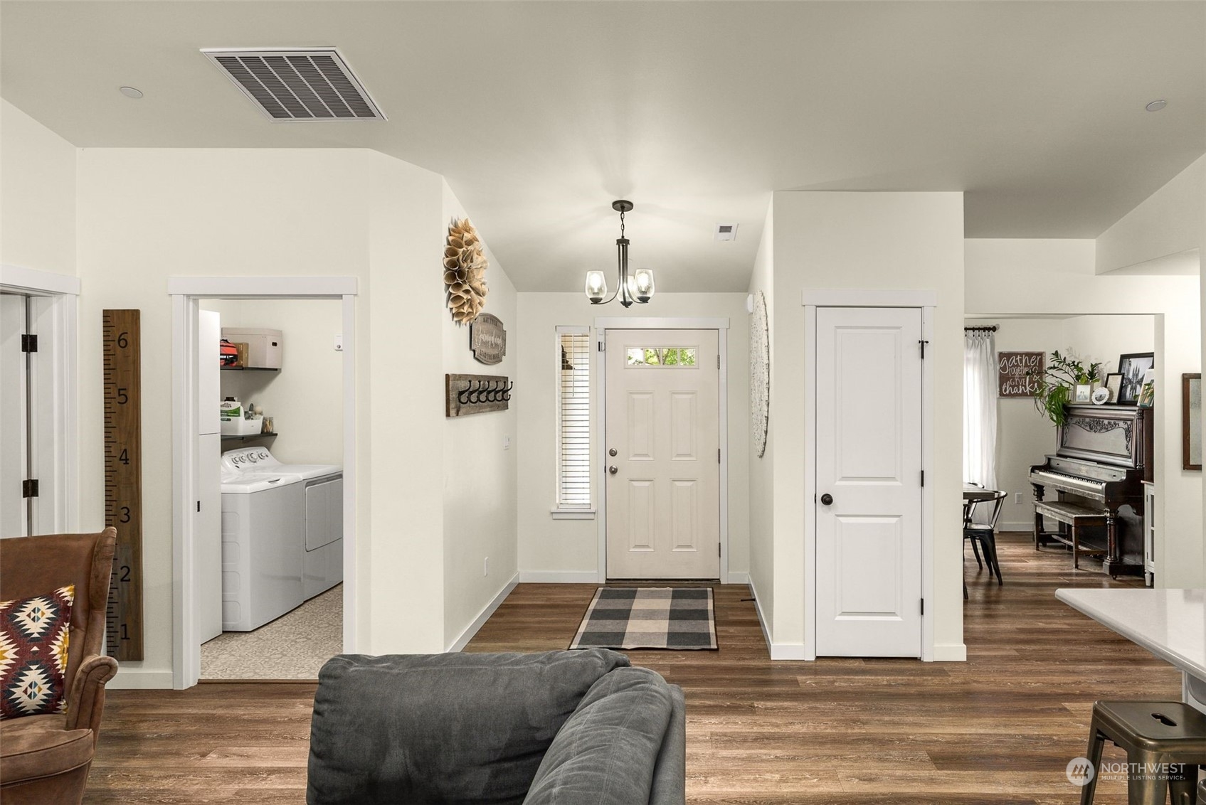 9924 Angeline Road East Bonney Lake, WA 98391 - Photo 9 of 31 a living room with furniture and a wooden floor