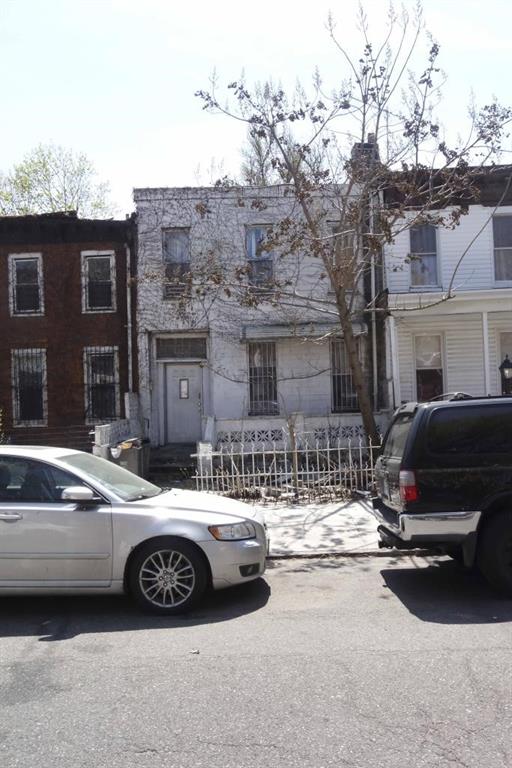 a car parked in front of a house