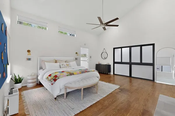 a bedroom with a bed and a table