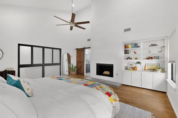 a bed room with a bed and a television