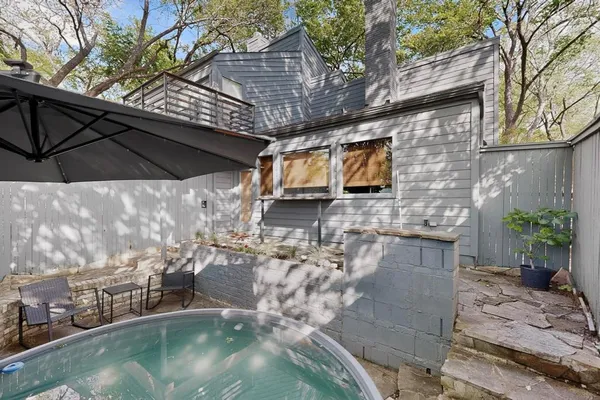 a backyard of a house with seating space