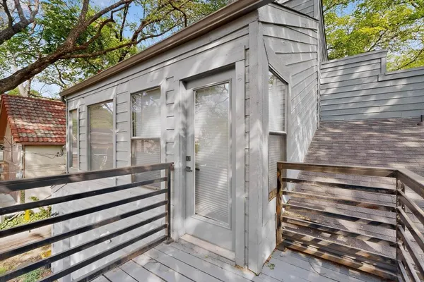 a view of a wooden door of a house
