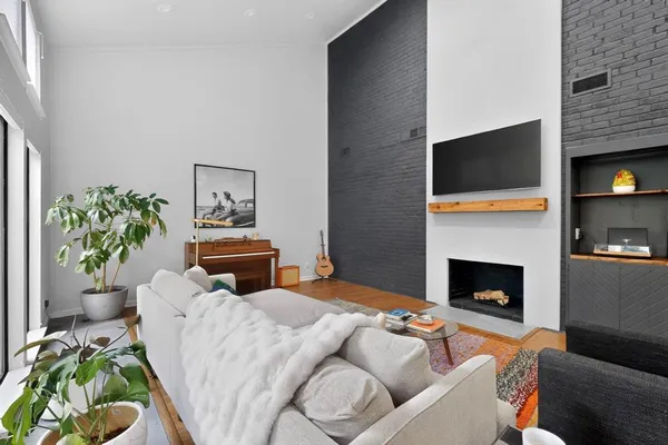 a bedroom with a bed and a fireplace