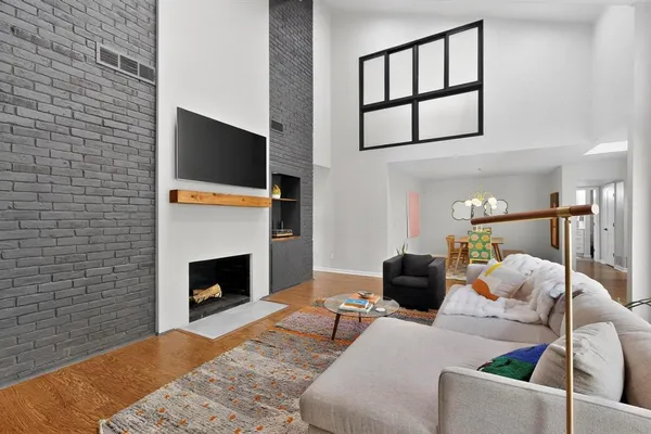 a living room with furniture and a fireplace