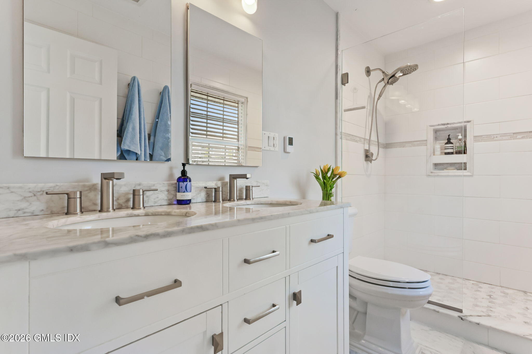 97 Davenport Ridge Lane Stamford, CT 06903 - Photo 16 of 31 a bathroom with a granite countertop sink a toilet and a mirror