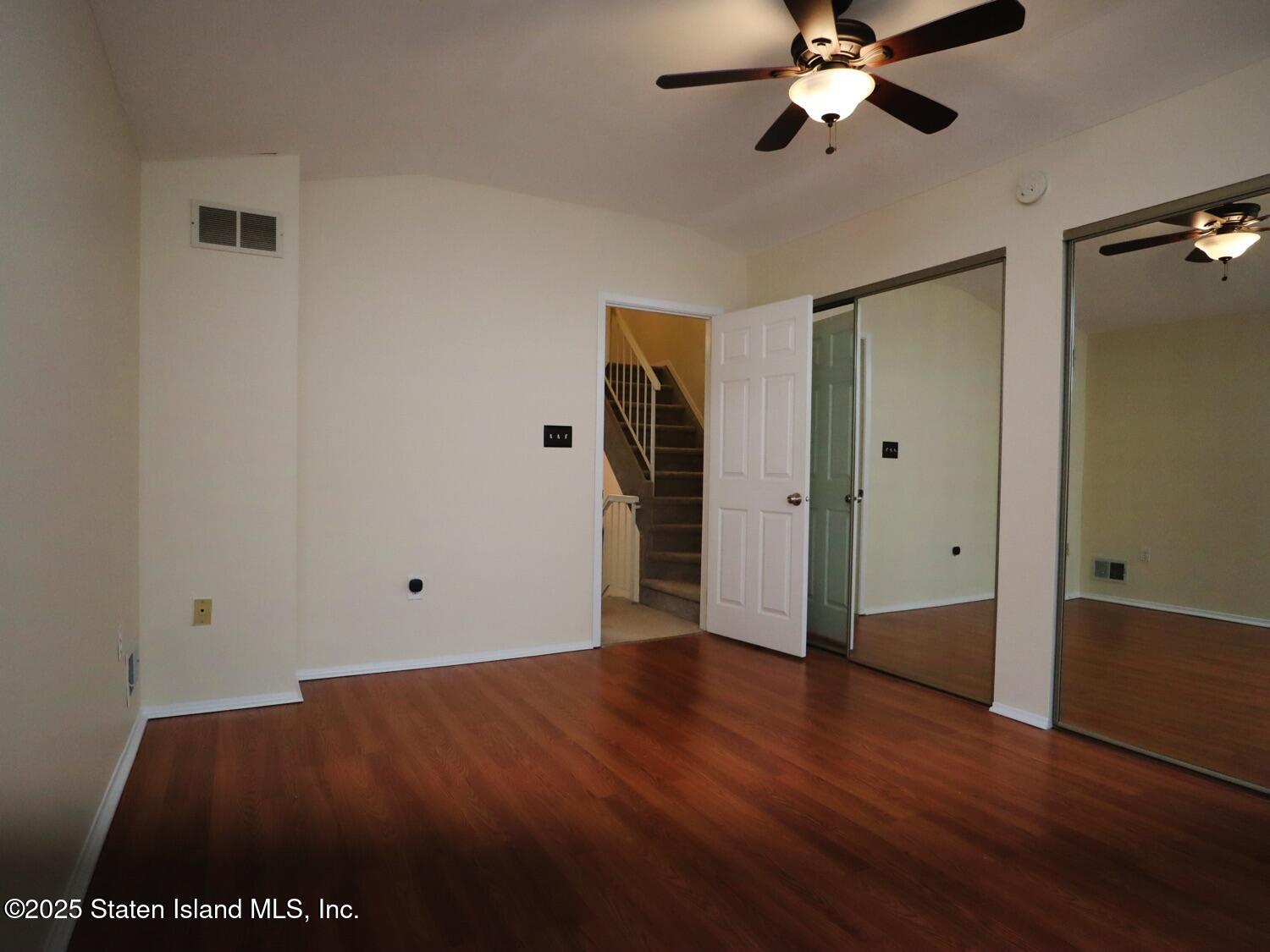 75 Chesebrough Street Staten Island, NY 10312 - Photo 13 of 32 a view of an empty room and wooden floor