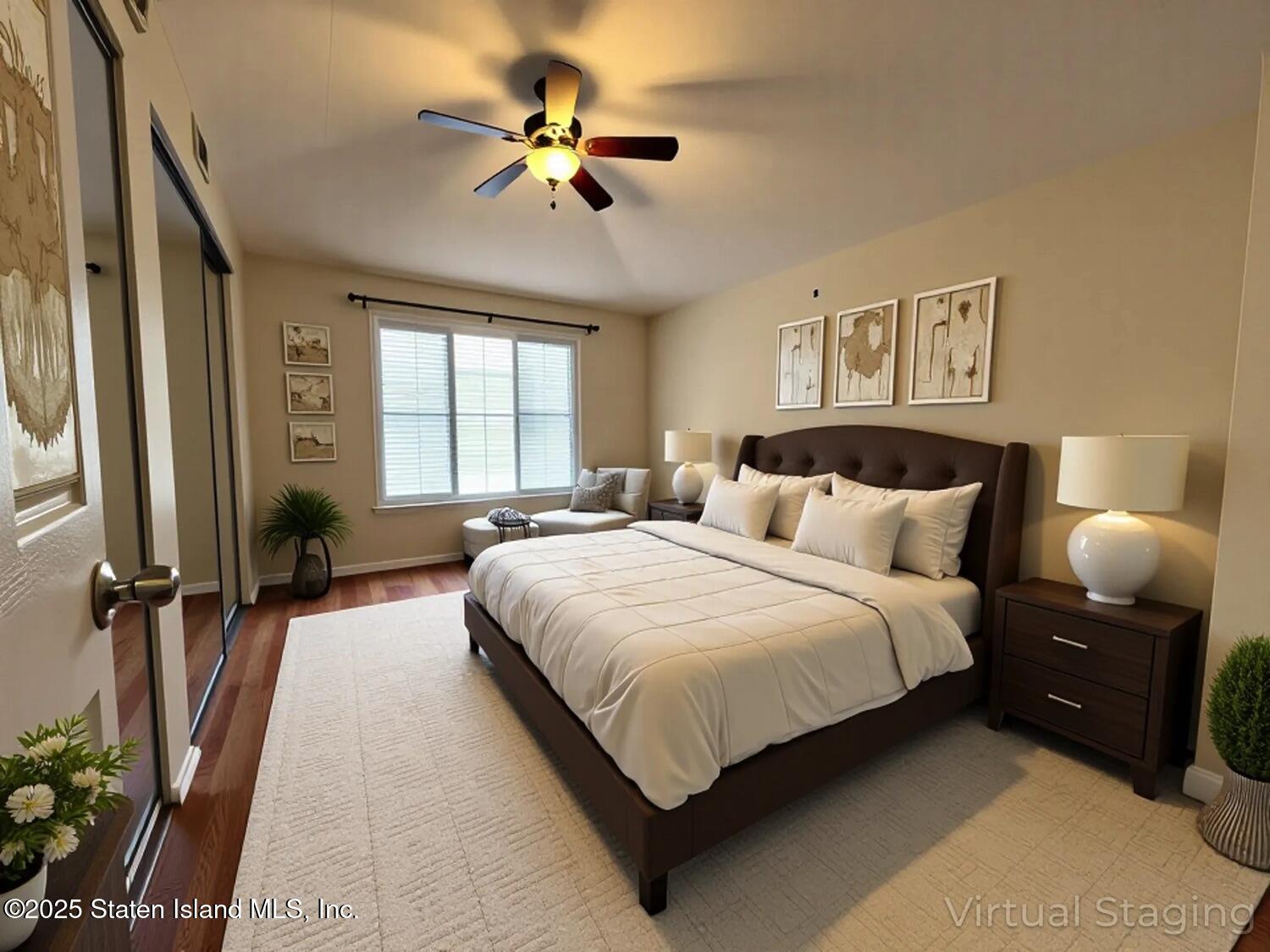 75 Chesebrough Street Staten Island, NY 10312 - Photo 15 of 32 a spacious bedroom with a bed a couch and a chandelier