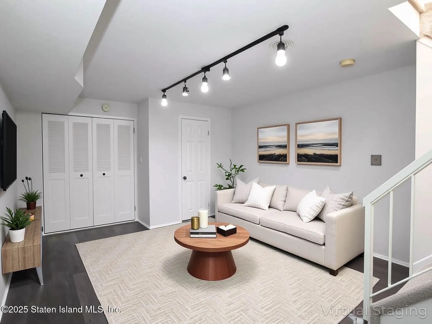 75 Chesebrough Street Staten Island, NY 10312 - Photo 24 of 32 a living room with furniture and a potted plant
