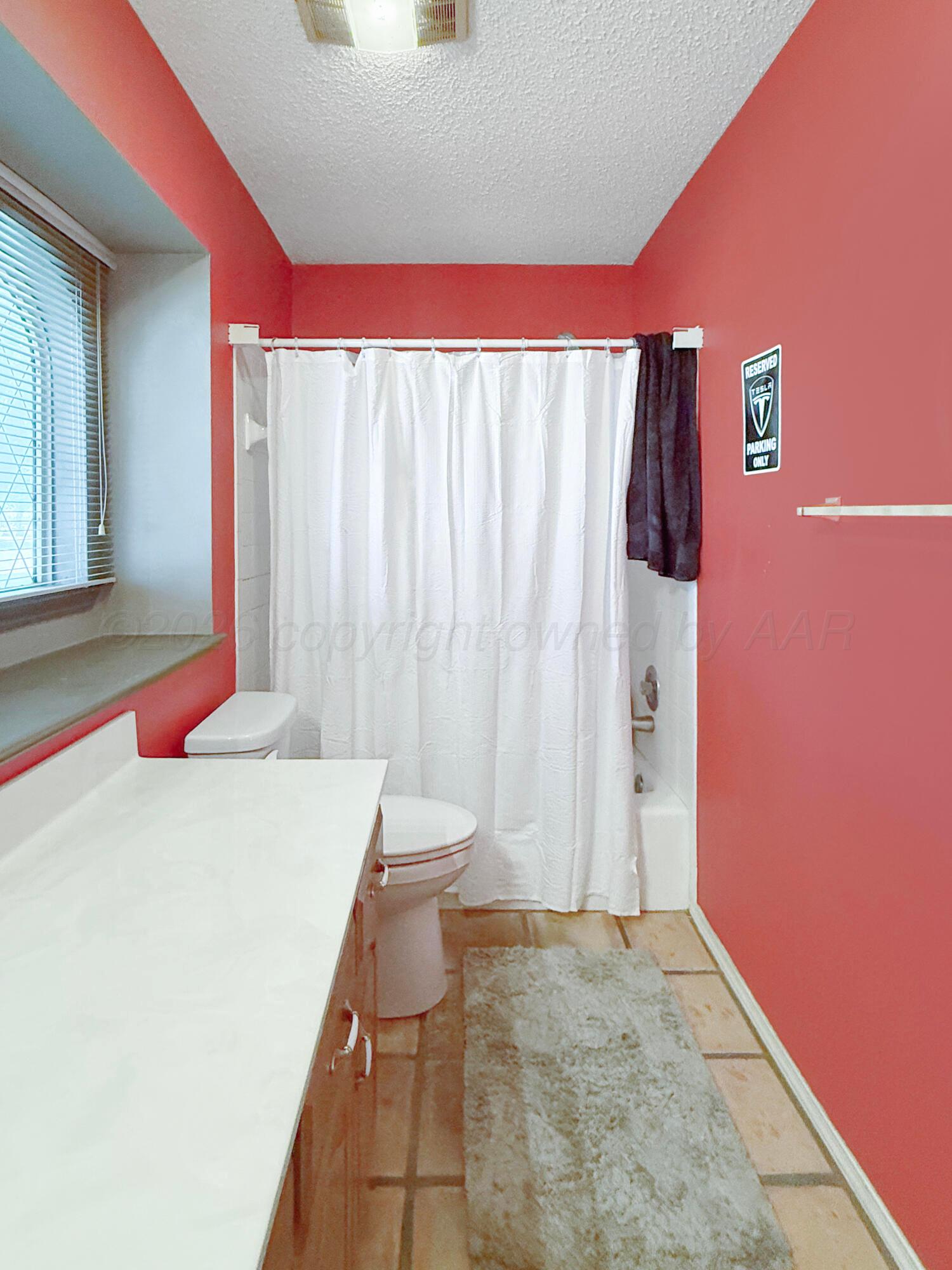 218 West Ocla Street Borger, TX 79007 - Photo 11 of 37 a room with a bed and a dresser