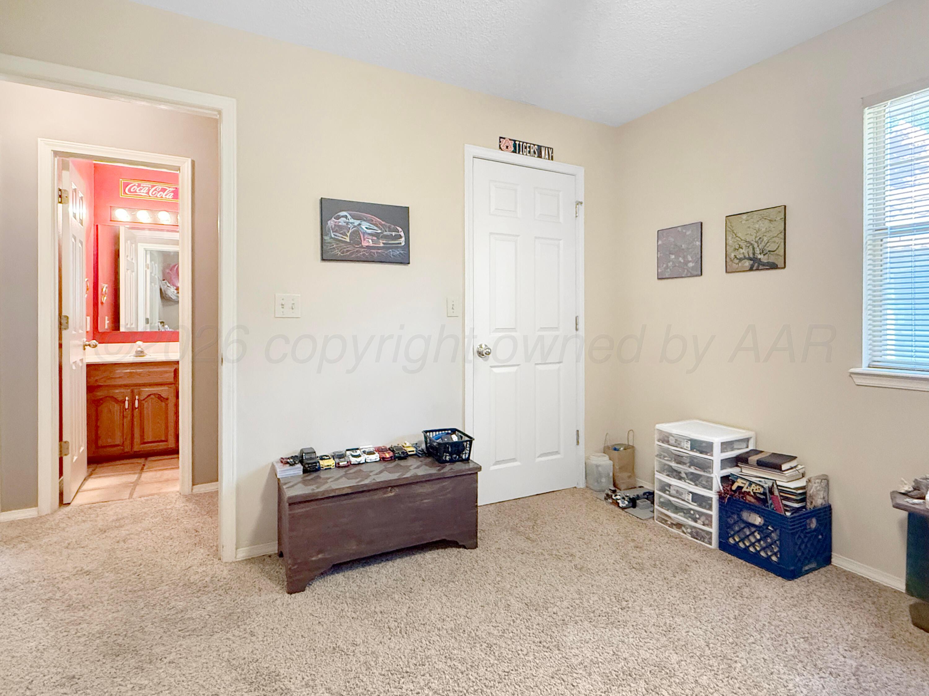218 West Ocla Street Borger, TX 79007 - Photo 13 of 37 a room with furniture and window