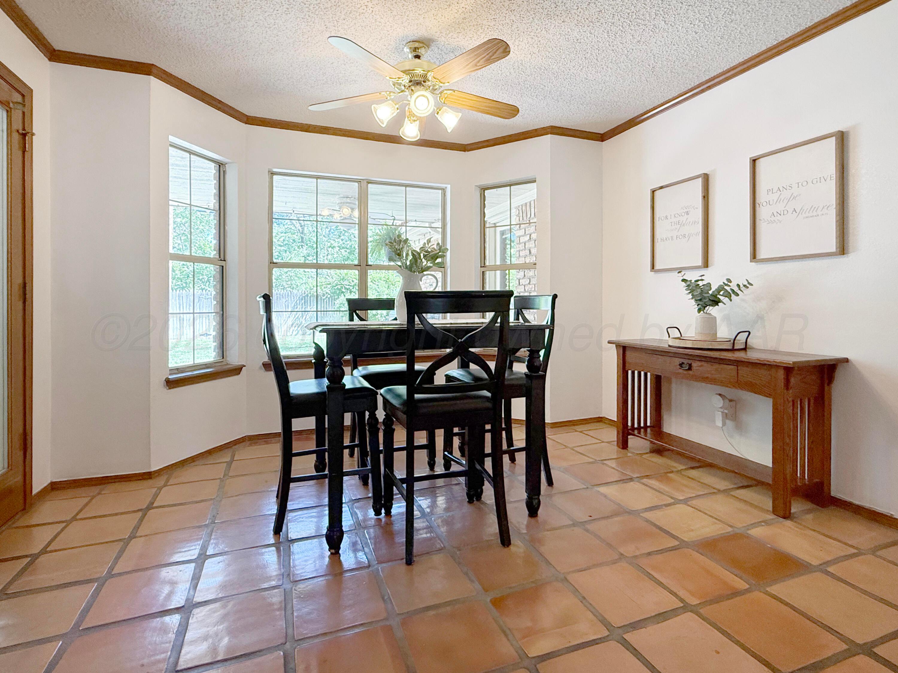 218 West Ocla Street Borger, TX 79007 - Photo 20 of 37 a view of a dining room with furniture and chandelier