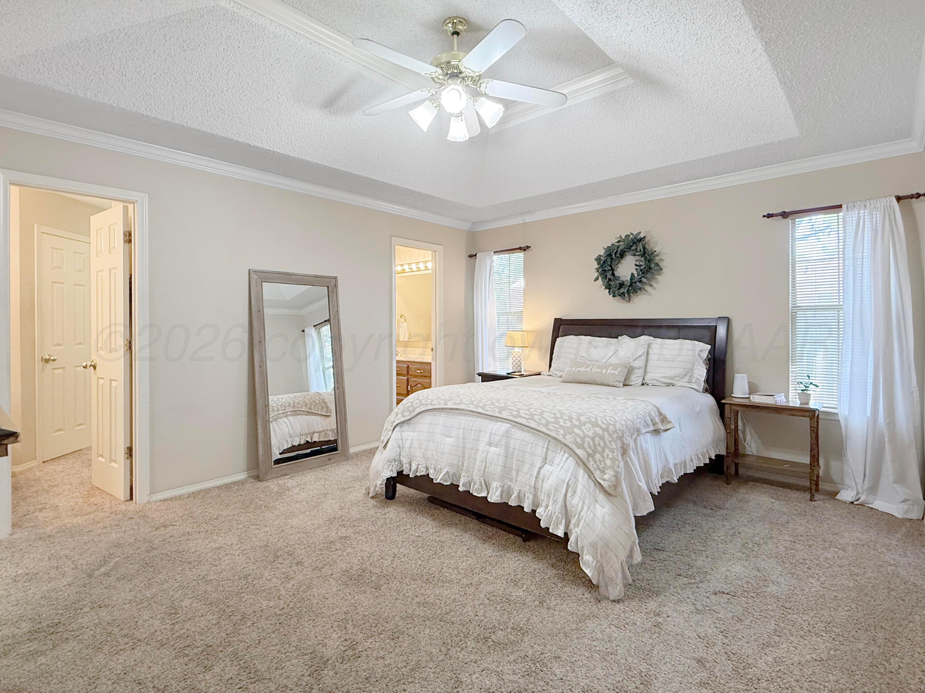 218 West Ocla Street Borger, TX 79007 - Photo 21 of 37 a bedroom with a bed and a table