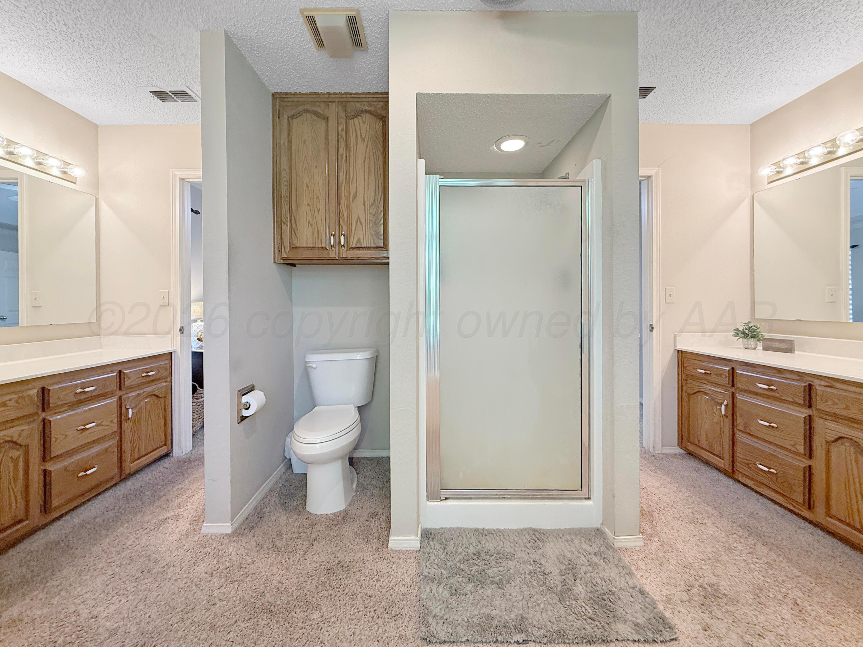 218 West Ocla Street Borger, TX 79007 - Photo 24 of 37 a spacious bathroom with a granite countertop sink toilet and shower
