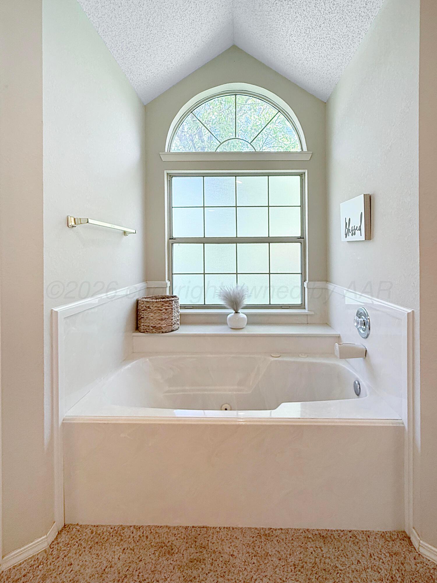 218 West Ocla Street Borger, TX 79007 - Photo 25 of 37 a bath tub sitting next to a window