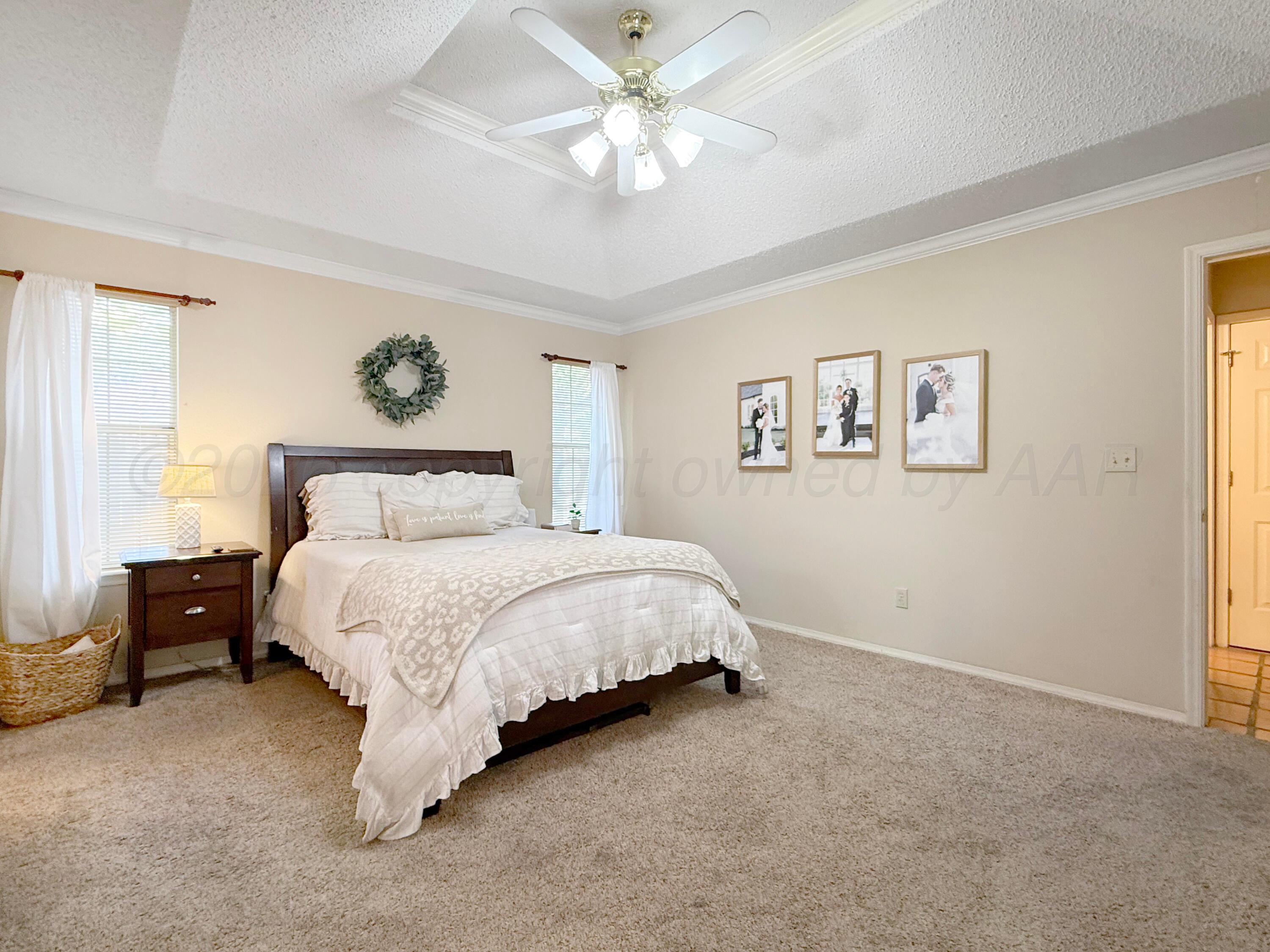 218 West Ocla Street Borger, TX 79007 - Photo 26 of 37 a bedroom with a bed and a painting on the wall