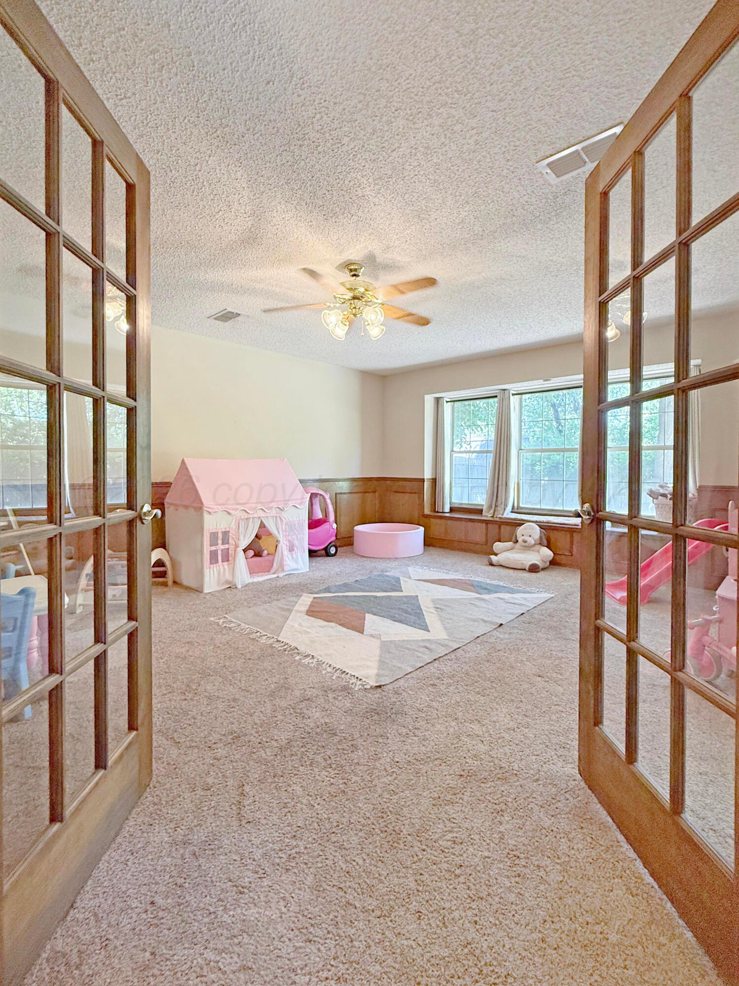 218 West Ocla Street Borger, TX 79007 - Photo 32 of 37 wooden floor in a room with a large window