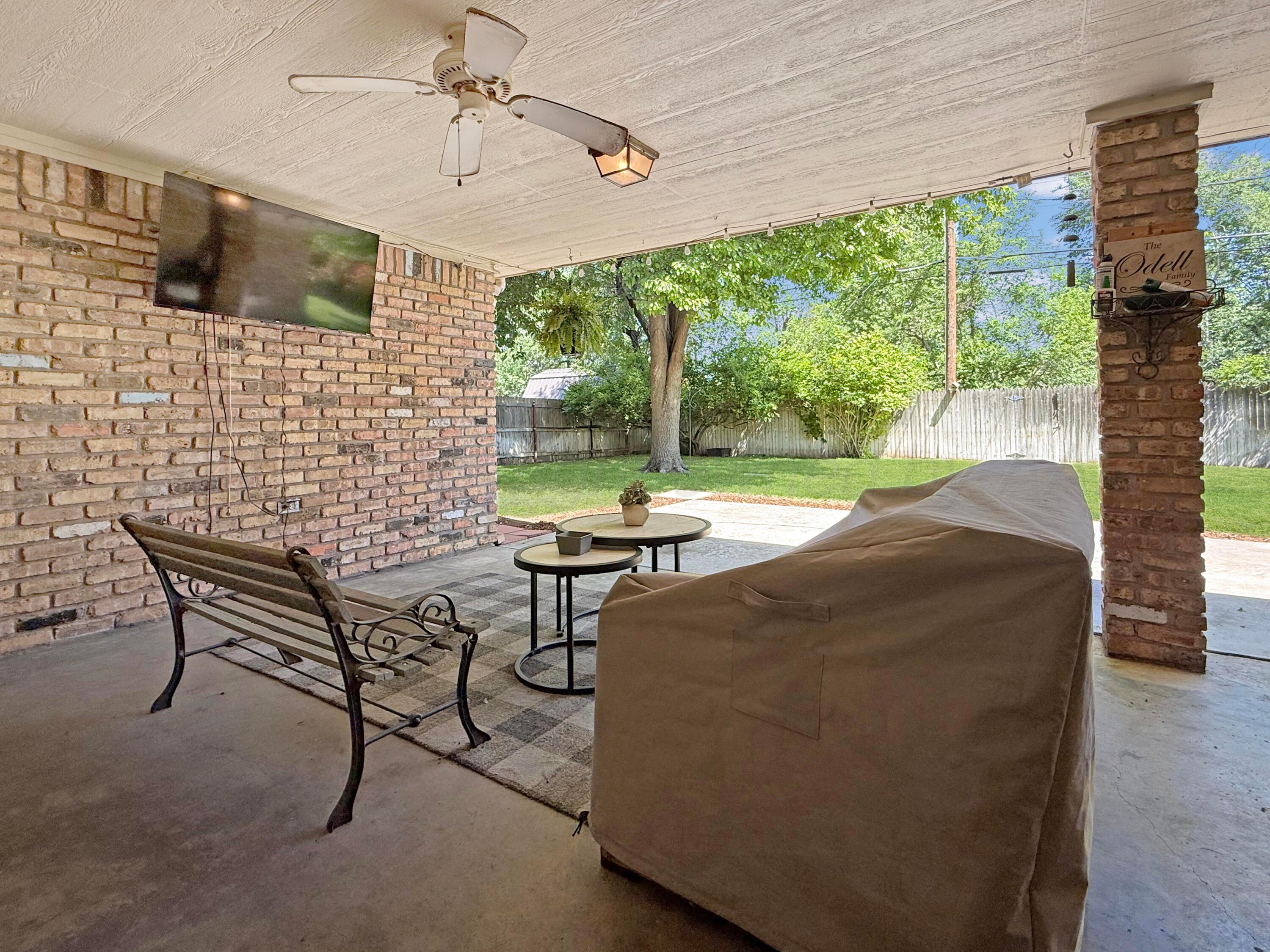 218 West Ocla Street Borger, TX 79007 - Photo 33 of 37 a living room with patio furniture and a fireplace