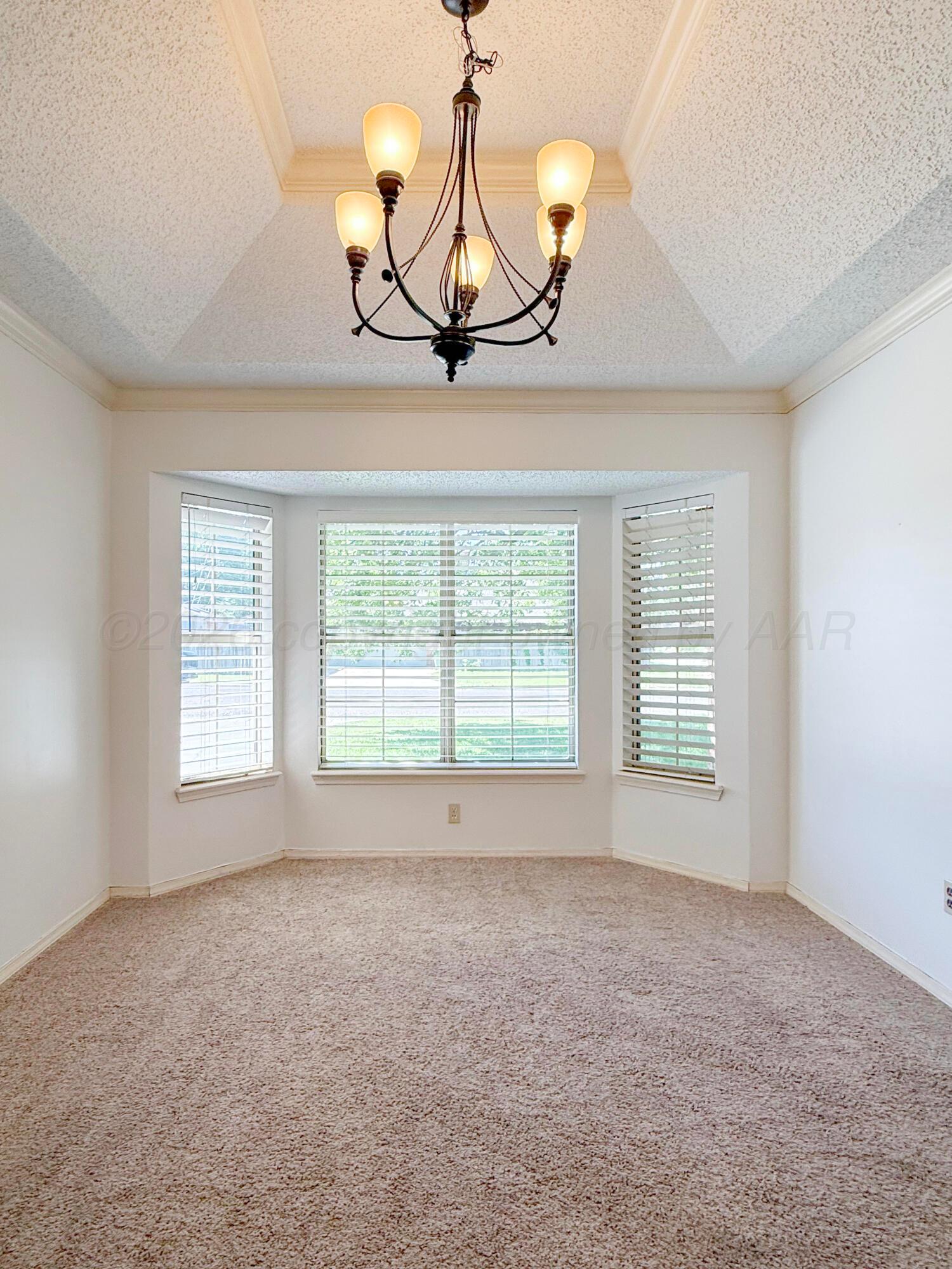 218 West Ocla Street Borger, TX 79007 - Photo 5 of 37 a view of an empty room with a window