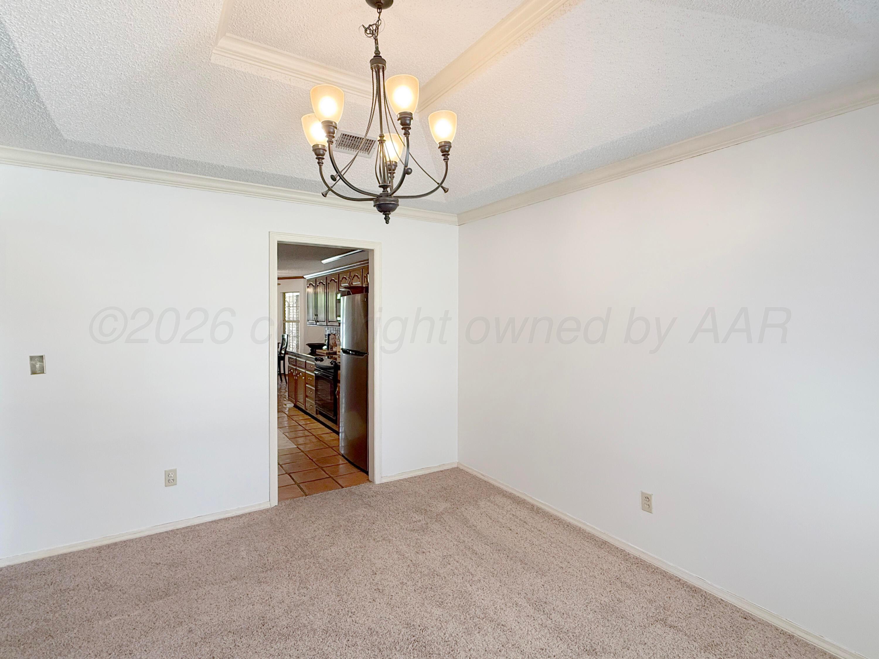 218 West Ocla Street Borger, TX 79007 - Photo 6 of 37 a view of a chandelier in a room