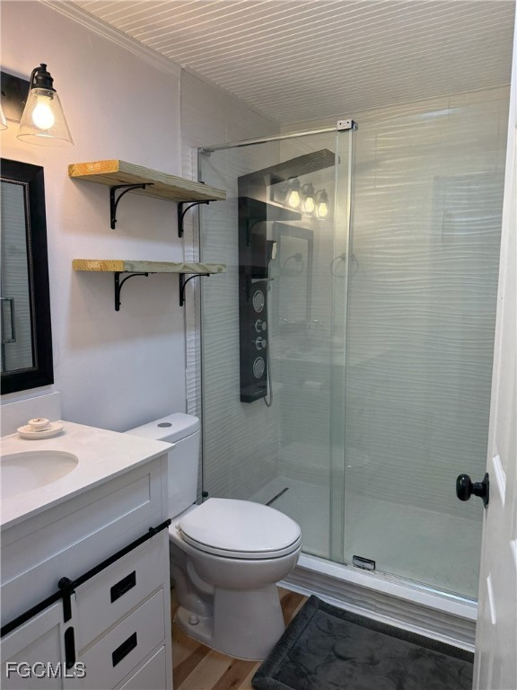 5330 Treetops Drive, Unit F4 Naples, FL 34113 - Photo 6 of 9 a bathroom with a sink a toilet and shower