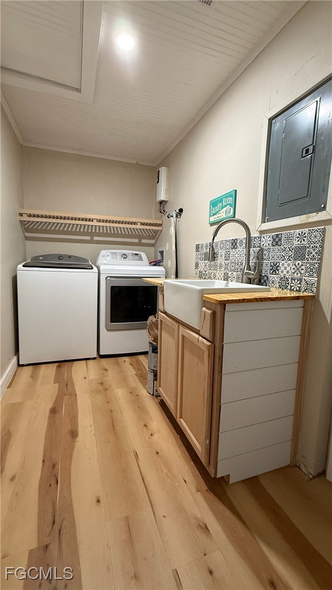 5330 Treetops Drive, Unit F4 Naples, FL 34113 - Photo 8 of 9 a utility room with washer and dryer