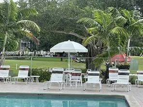 a view of a park with large trees