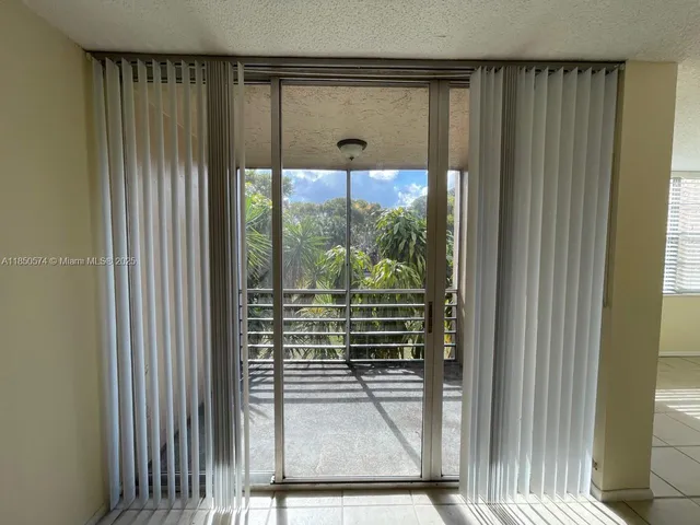 a view of a door and a window