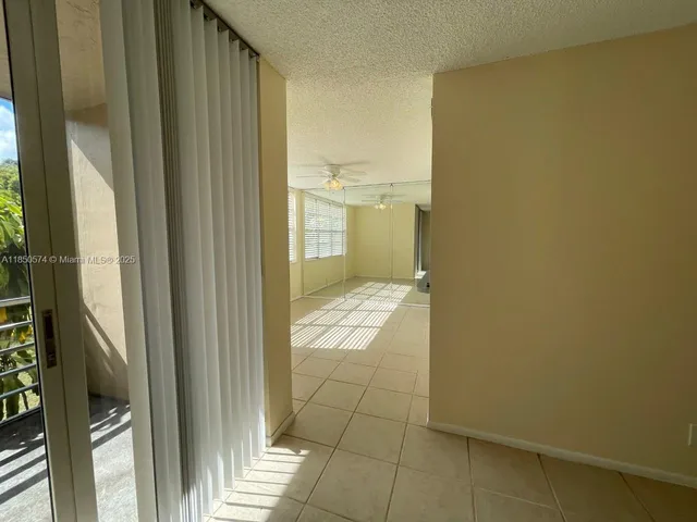 a bathroom with a glass door shower and a sink