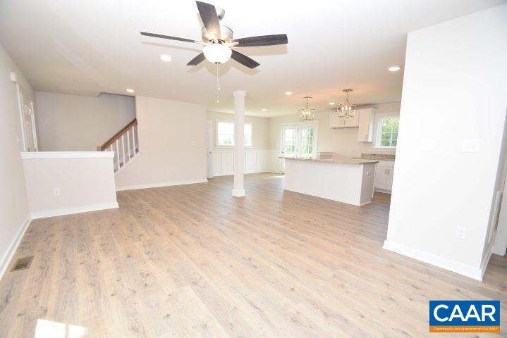 182 Riva Way Palmyra, VA 22963 - Photo 5 of 25 a view of a kitchen with kitchen island wooden floor center island and stainless steel appliances