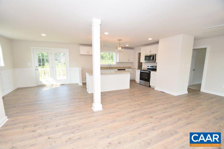 182 Riva Way Palmyra, VA 22963 - Photo 7 of 25 a view of a kitchen with a sink and a refrigerator
