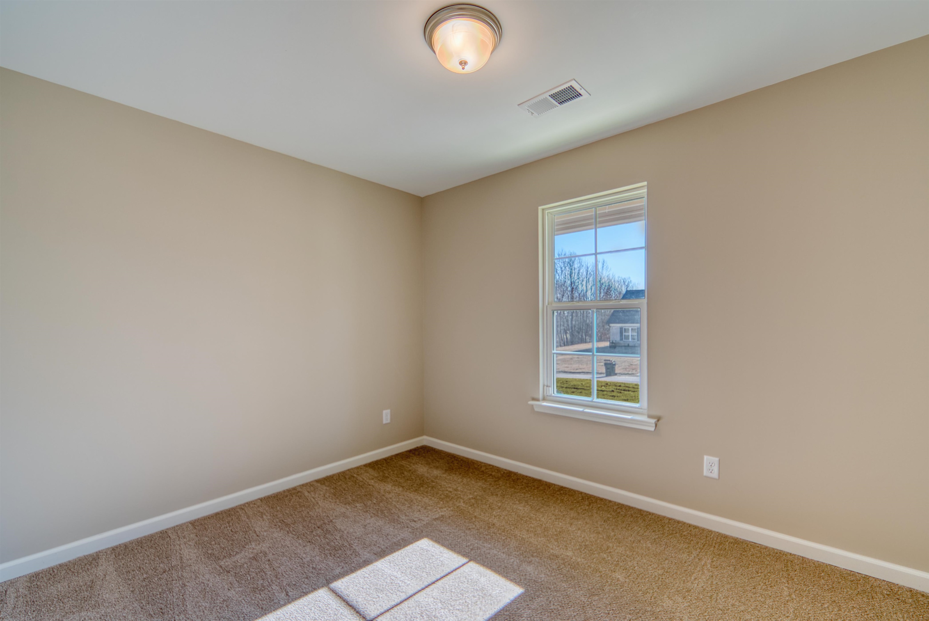 102 Stone Brook Cove Ripley, TN 38063 - Photo 16 of 32 Carpeted spare room with baseboards