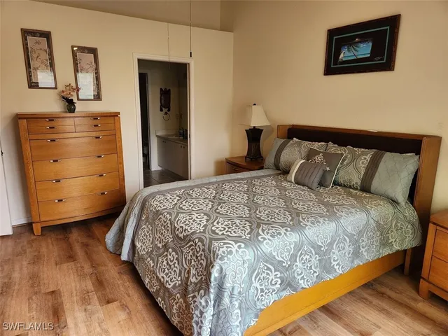 a bedroom with a bed and a dresser