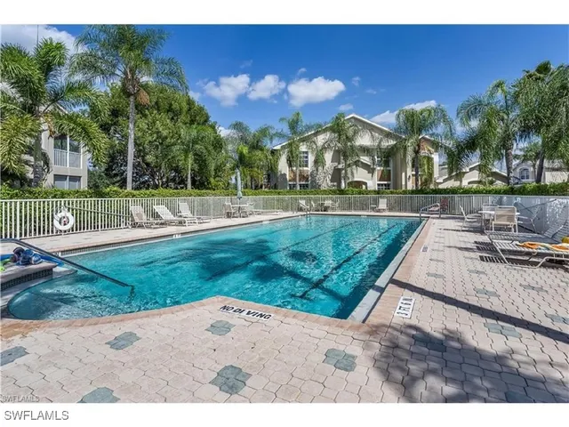 a view of a park with large trees