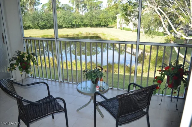 a view of a chairs and table in patio