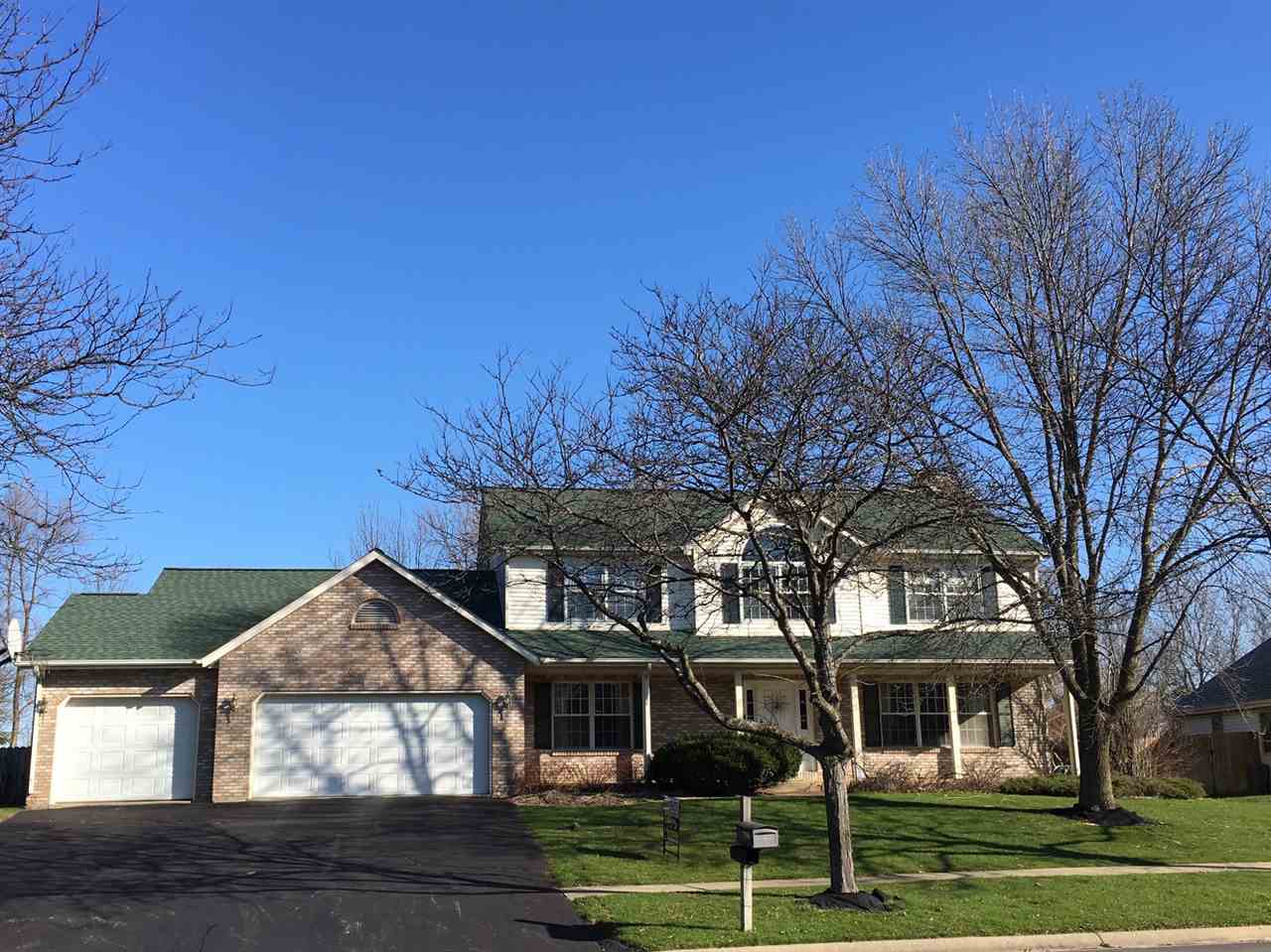 7196 Sentinel Road Rockford, IL 61107 - Photo 1 of 24 a front view of a house with a yard