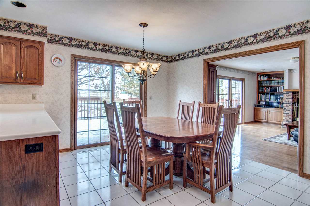 7196 Sentinel Road Rockford, IL 61107 - Photo 11 of 24 a view of a dining room with furniture window and wooden floor