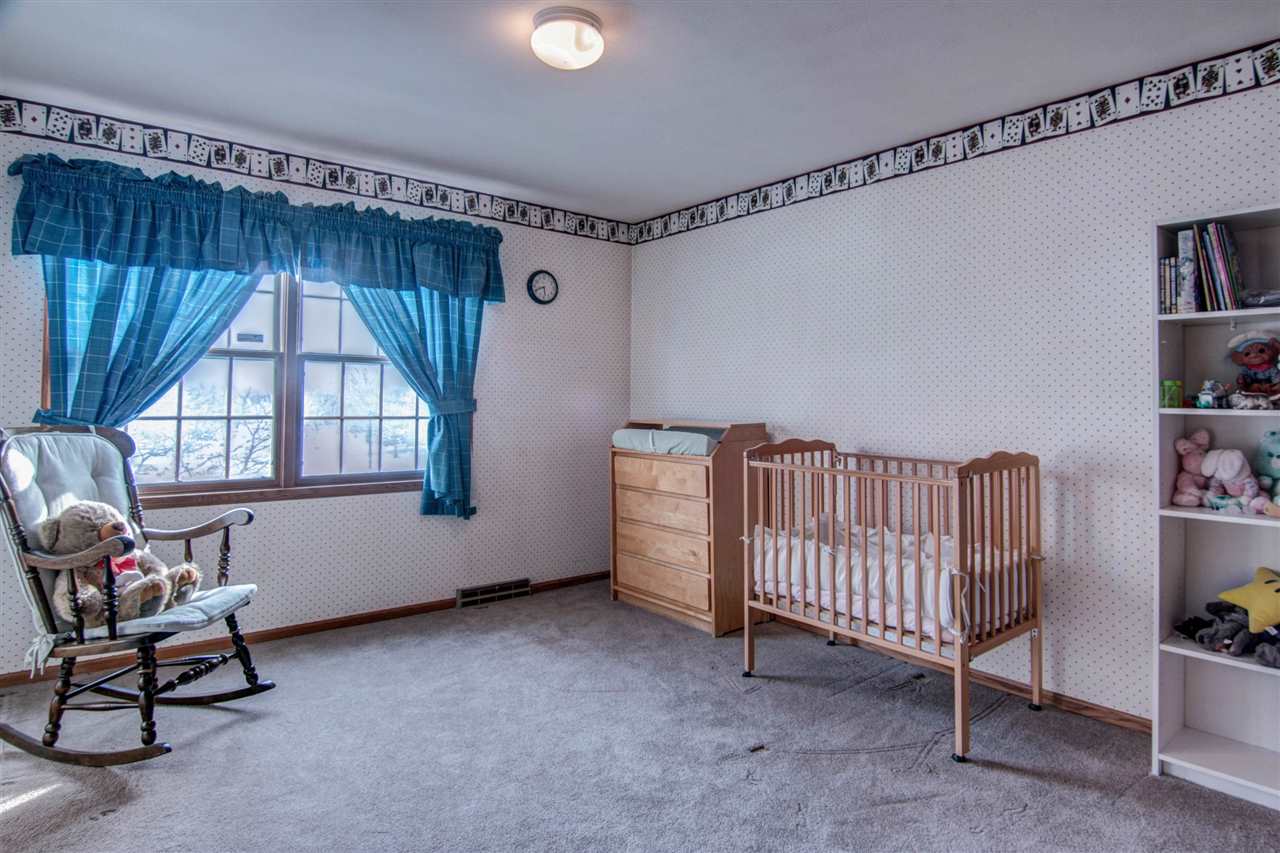 7196 Sentinel Road Rockford, IL 61107 - Photo 12 of 24 a view of a room with window and furniture