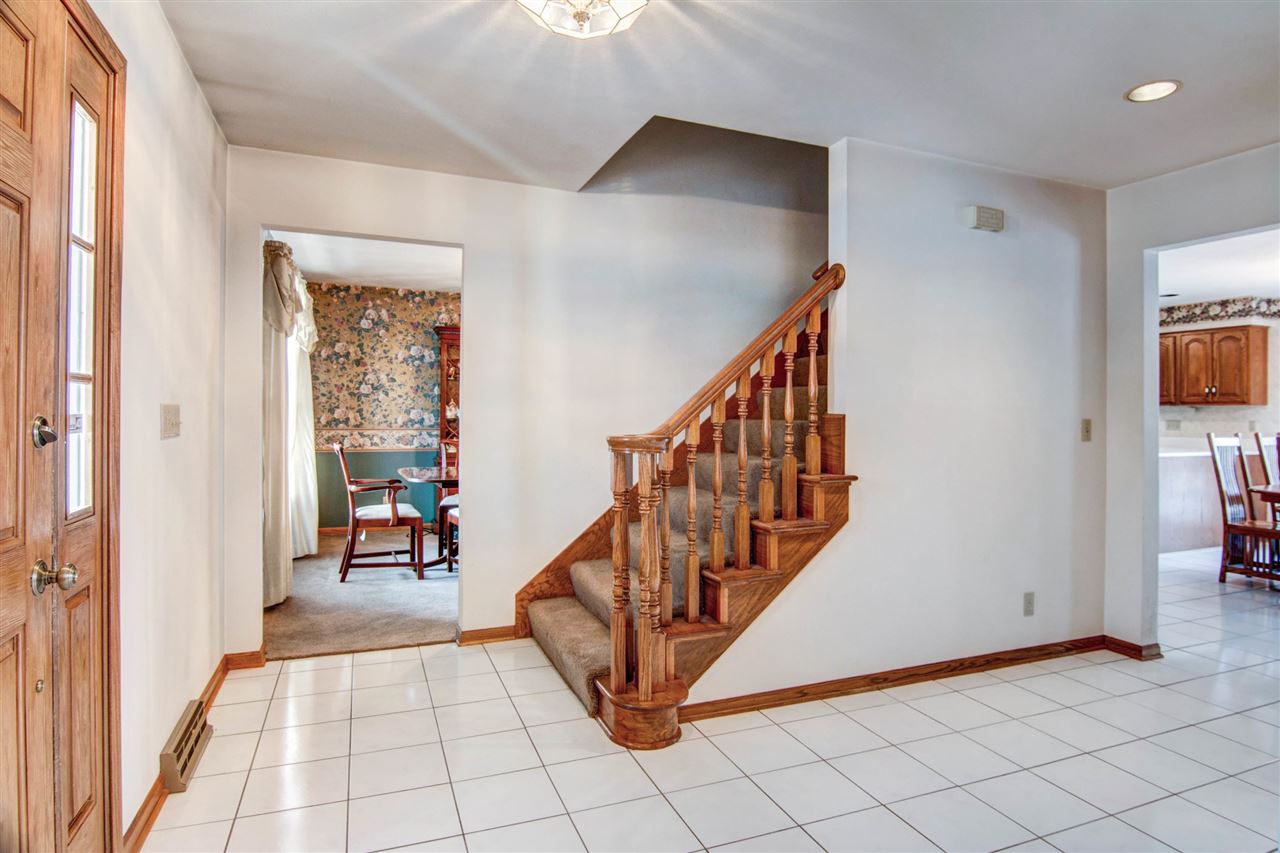 7196 Sentinel Road Rockford, IL 61107 - Photo 2 of 24 a view of an entryway with stairs