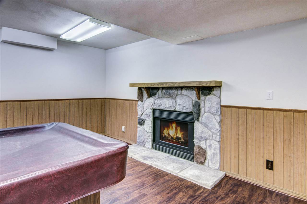 7196 Sentinel Road Rockford, IL 61107 - Photo 21 of 24 a living room with a fireplace